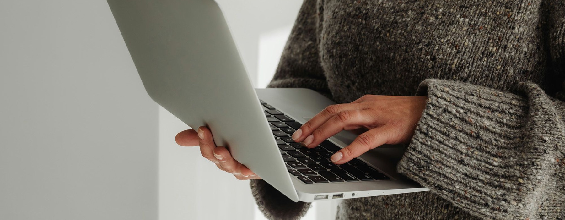 A person holding a laptop