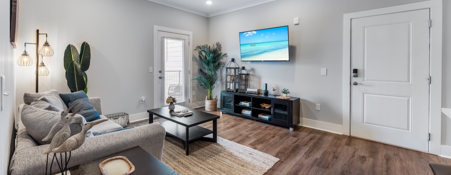 a living room with a tv and couches